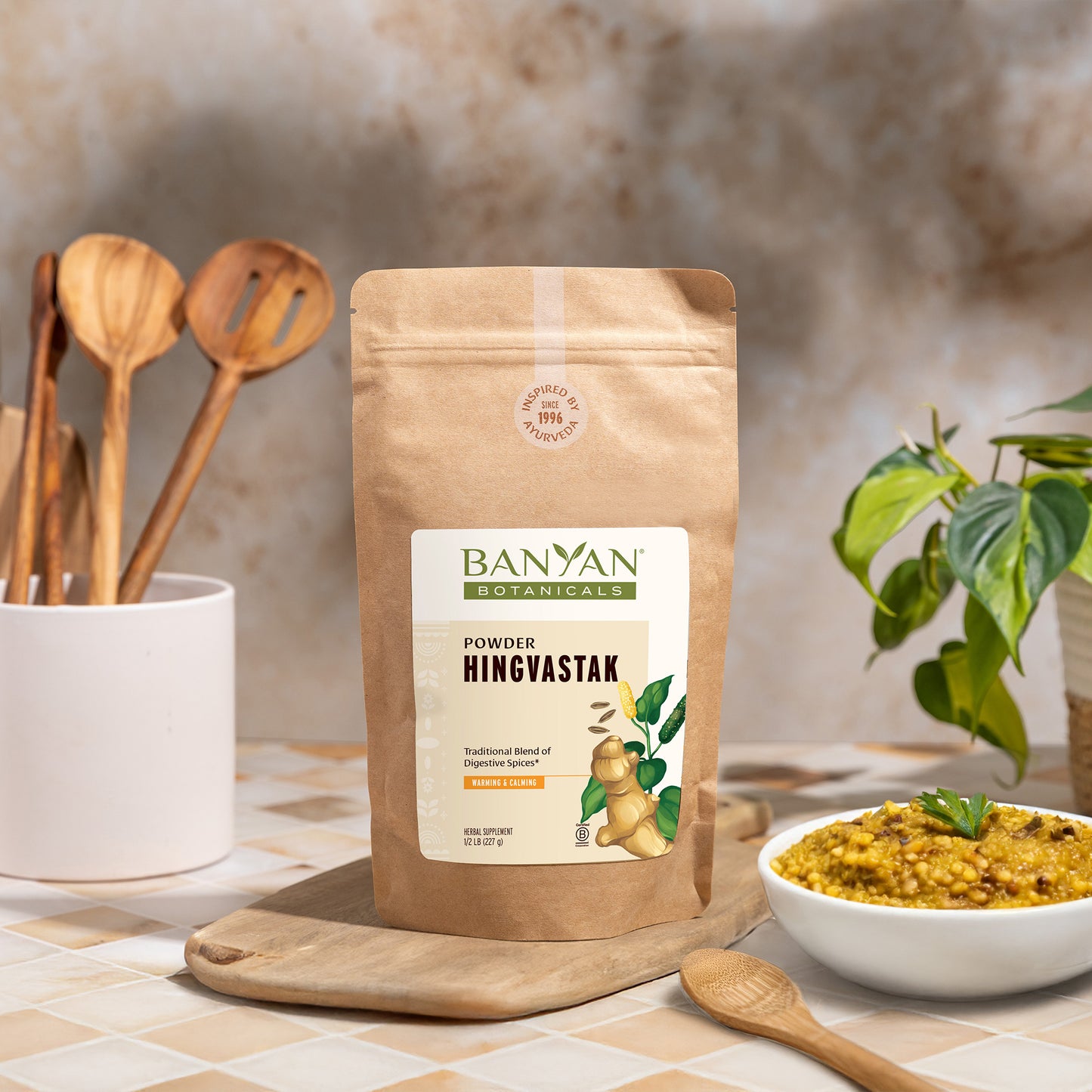 1/2 lb: Hingvastak pouch sitting on counter next to bowl of dal 