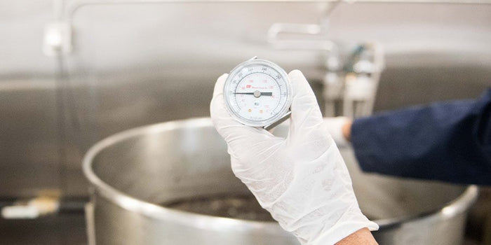 hand holding thermometer